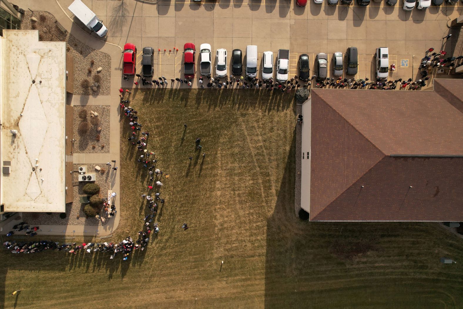 People wait in line to attend a campaign event held by former President Donald Trump in Sioux Center, Iowa, on Friday, January 5.