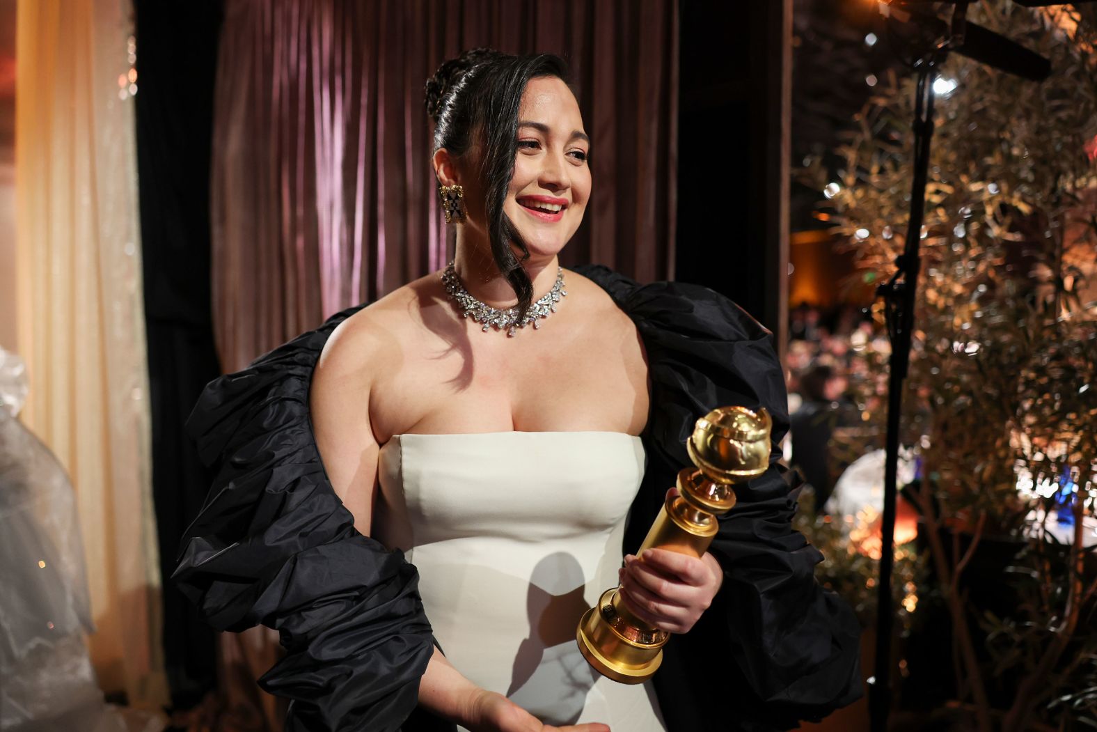 Lily Gladstone holds the Golden Globe Award she won for her performance in the film "Killers of the Flower Moon" on Sunday, January 7. <a href="index.php?page=&url=https%3A%2F%2Fwww.cnn.com%2F2024%2F01%2F07%2Fentertainment%2Flily-gladstone-makes-historic-golden-globe-win-for-a-person-who-identifies-as-indigenous%2Findex.html" target="_blank">Gladstone is the first person who identifies as indigenous</a> to win best performance by a female actor in a dramatic motion picture.