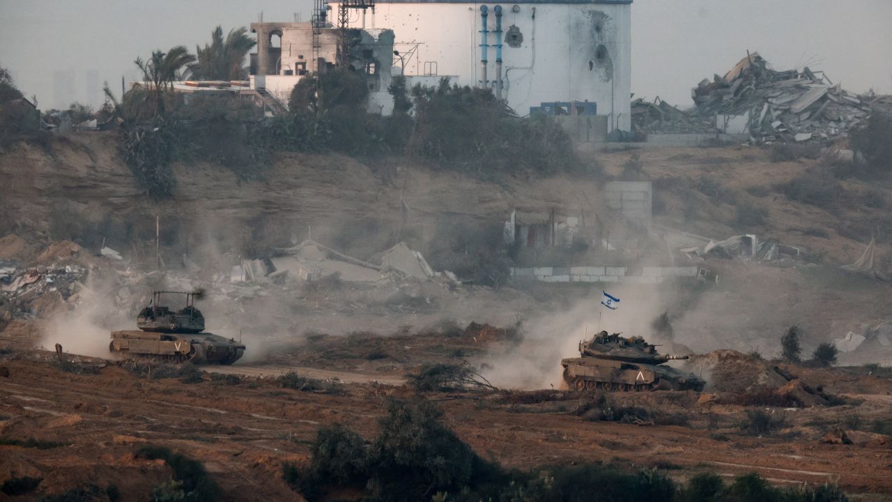 Tanks manoeuvre in central Gaza, amid the ongoing conflict between Israel and the Palestinian Islamist group Hamas, as seen from Israel's border with Gaza in southern Israel, January 9, 2024. REUTERS/Amir Cohen