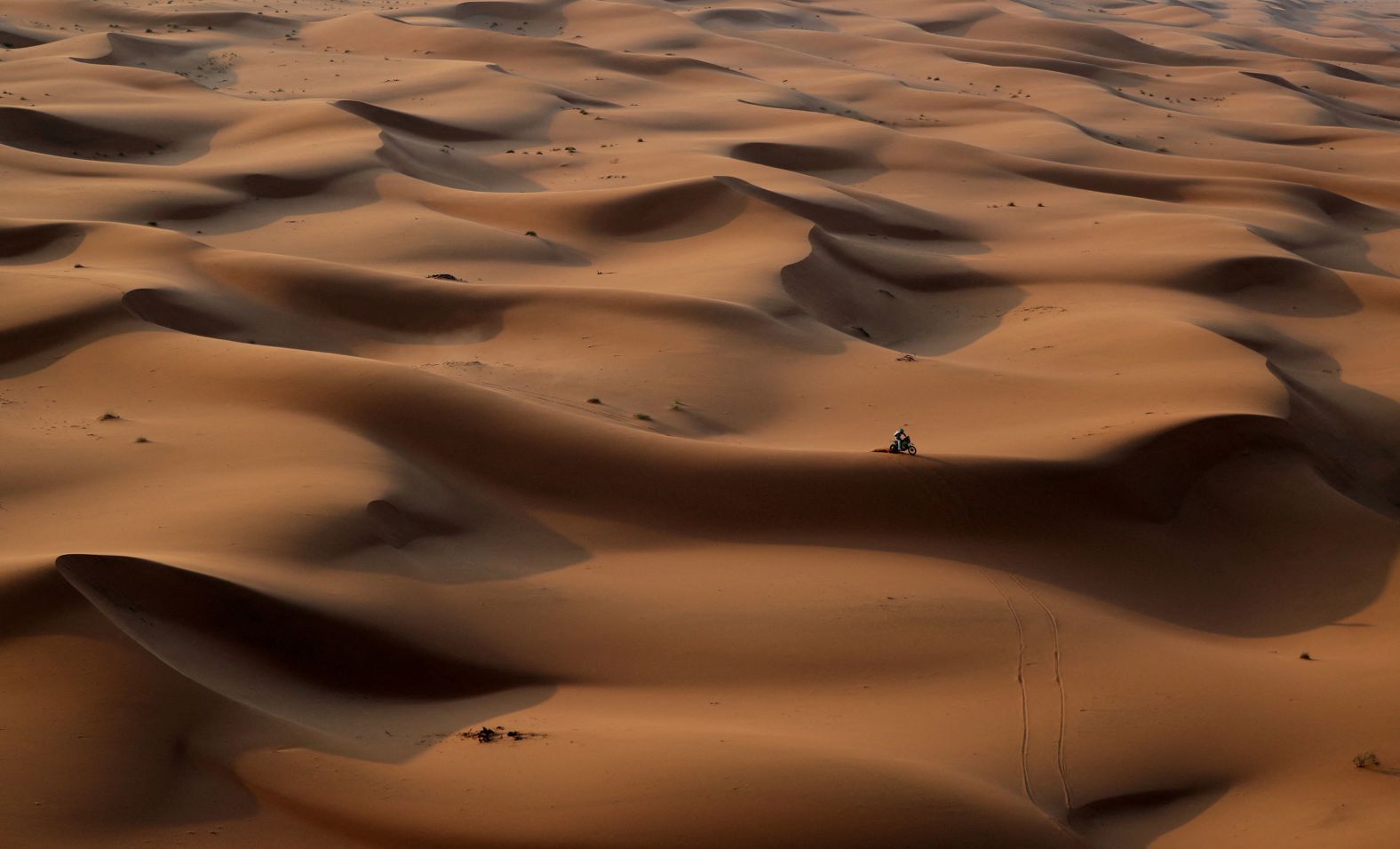 A competitor rides a motorbike Sunday, January 7, during the second stage of the Dakar Rally, which took place between Al Henakiyah and Al Duwadimi in Saudi Arabia.