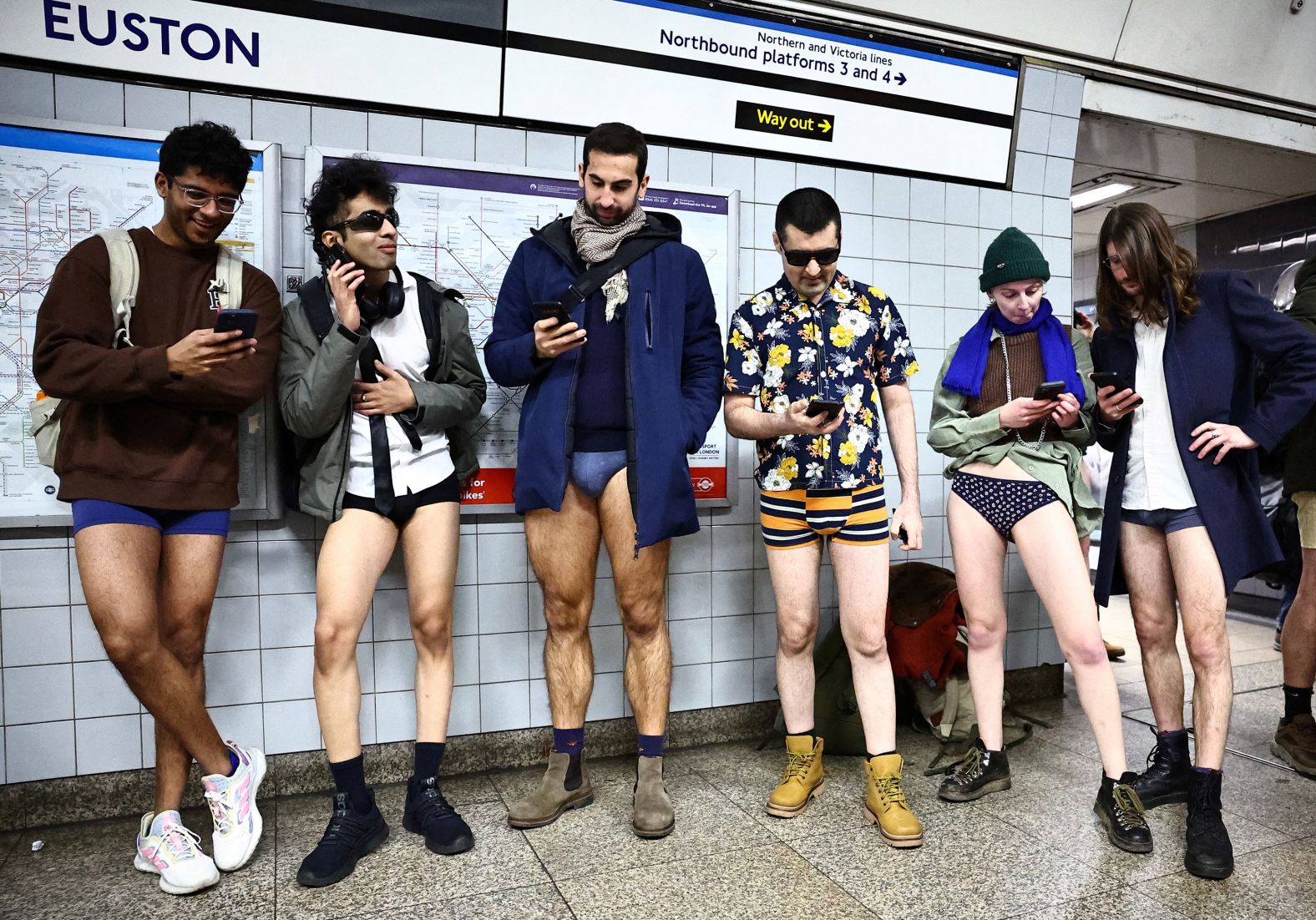 People in London wait for a train while participating in the No Pants Subway Ride on Sunday, January 7. The annual event, started in 2002 by Improv Everywhere in New York, has spread to other cities across the globe. People ride the subway dressed in normal winter clothes without pants — all while keeping a straight face.