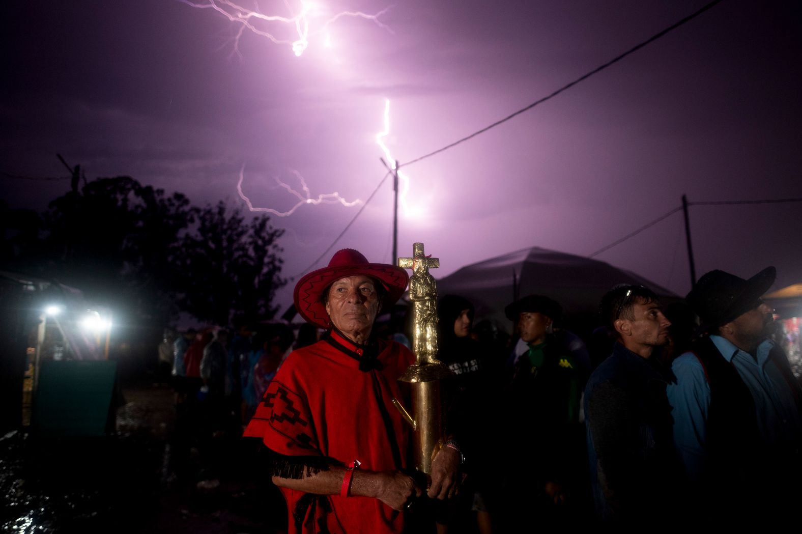 Julio Rivero holds a figure of folk saint Gauchito Gil at Gil's sanctuary in Mercedes, Argentina, on Saturday, January 7. Every year, people from across the country visit Gil's sanctuary to ask for miracles or give him thanks. 