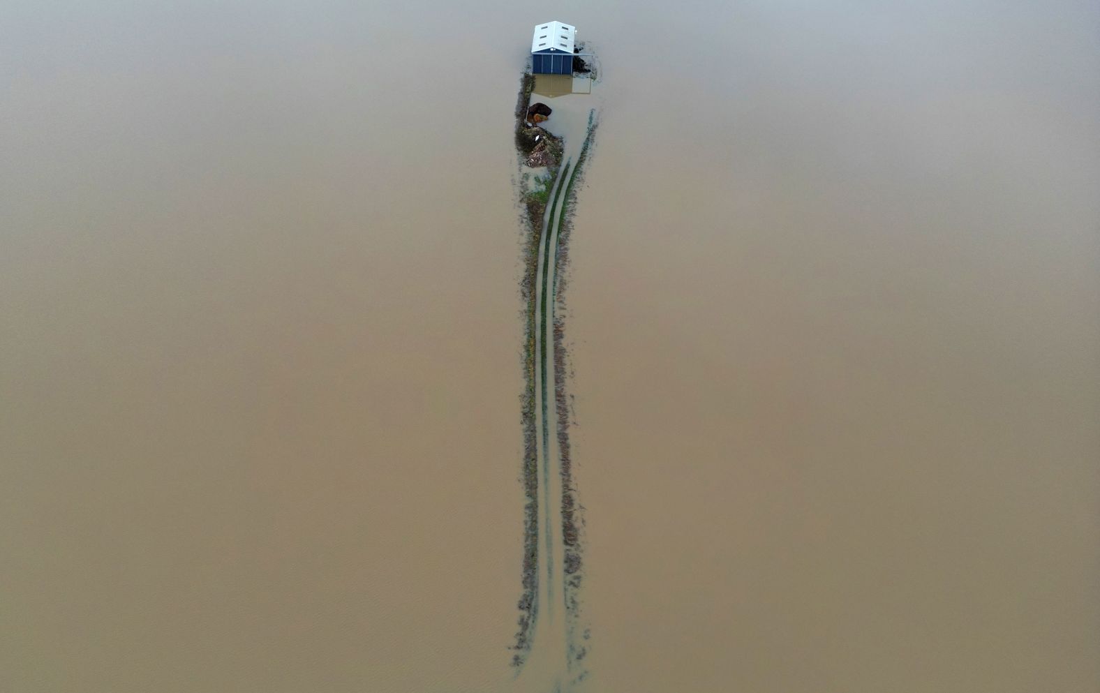 A barn in Nottingham, England, is surrounded by floodwater after heavy rain from Storm Henk on Friday, January 5.