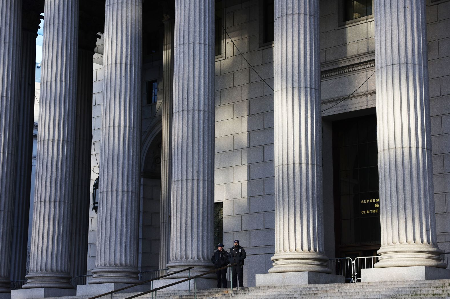 Court police stand outside the New York State Supreme Court during closing arguments on January 11.