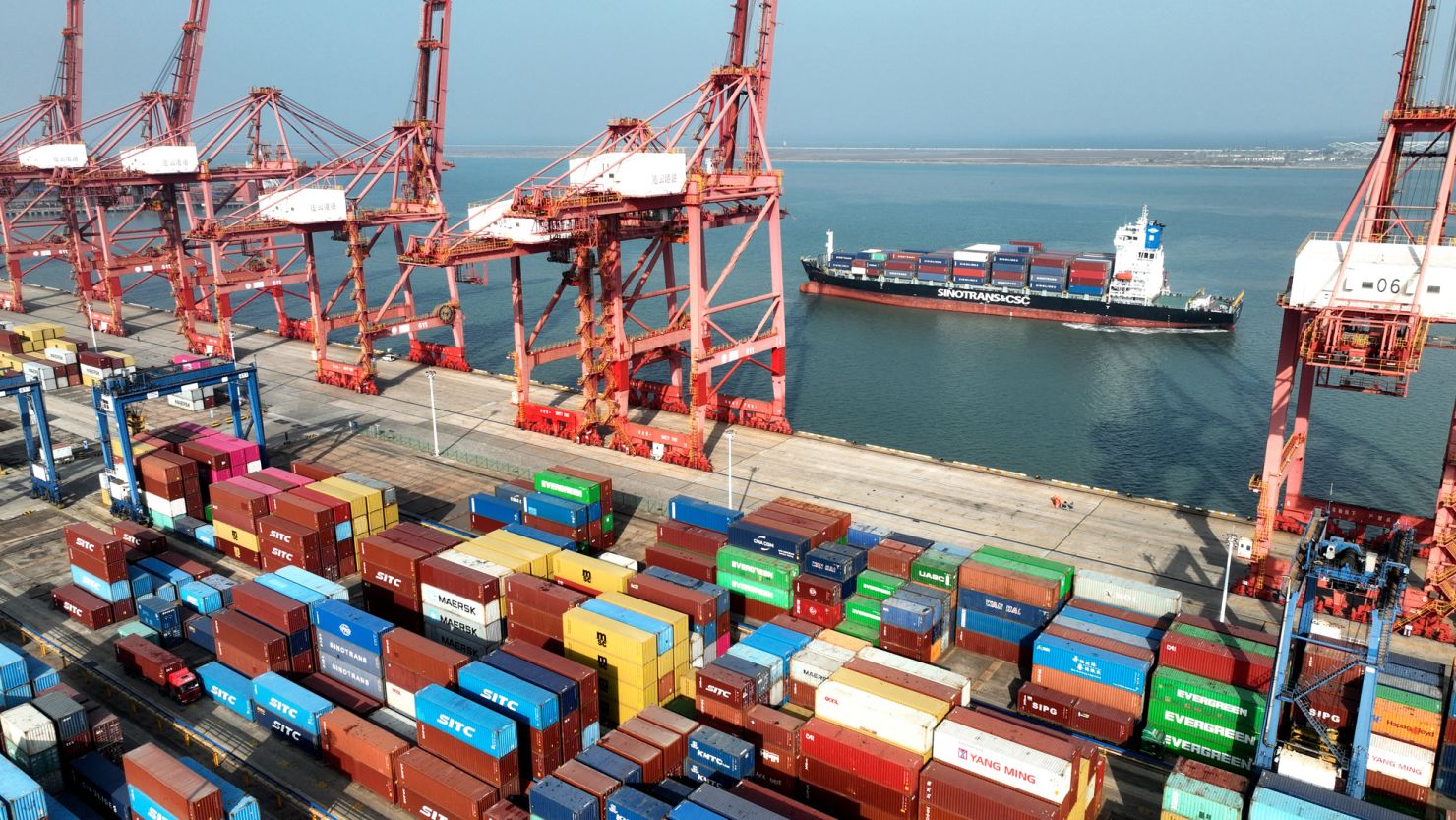 This photo taken on December 6, 2023 shows a cargo ship preparing to berth at the container terminal of Lianyungang Port in China's eastern Jiangsu Province. Chinese exports rose in November for the first time in seven months, officials said on December 7, as the country navigates a troubled recovery from the Covid-19 pandemic. (Photo by AFP) / China OUT (Photo by STR/AFP via Getty Images)