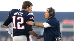 FOXBORO, MA - JANUARY 16: Tom Brady #12 and head coach Bill Belichick of the New England Patriots shake hands at the start of the AFC Divisional Playoff Game against the Kansas City Chiefs at Gillette Stadium on January 16, 2016 in Foxboro, Massachusetts.  (Photo by Maddie Meyer/Getty Images)