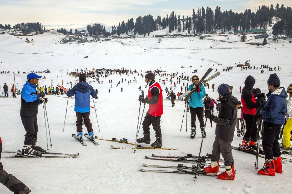 GULMARG, KASHMIR, INDIA - FEBRUARY 08: Locals and tourists learn to ski on a gentle slope on February 8,  2021  in Gulmarg, west of Srinagar, the summer capital of Indian-administered Kashmir, India.  Gulmarg, which is one of Asia's most popular ski resorts, usually welcomes a huge number of foreign and domestic tourists each winter, but this year the number of tourists has come down, causing financial losses to local businesses. Around 85 percent tourists used to be from foreign countries. The dip in tourist arrival to the ski resort has been due to the coronavirus pandemic, which has halted almost all foreign travel. The domestic tourist arrival has picked up a little in recent days after lifting of restrictions on low-speed Internet. 4G Internet was restored in Jammu and Kashmir after around more than seventeen months.  (Photo by Yawar Nazir/ Getty Images)