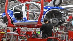 20 March 2023, Brandenburg, Gr'nheide: An employee of the Tesla Gigafactory Berlin Brandenburg works on a production line of a Model Y electric vehicle. The Tesla plant was opened and put into operation on March 22, 2022. In the meantime, about 10,000 people are employed there. Photo by: Patrick Pleul/picture-alliance/dpa/AP Images