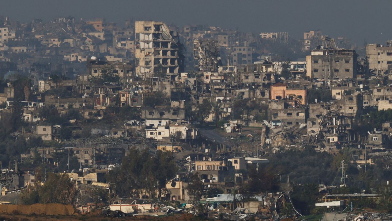 A view shows damaged buildings in Gaza, amid the ongoing conflict between Israel and the Palestinian Islamist group Hamas, as seen from Israel, January 12, 2024. REUTERS/Tyrone Siu