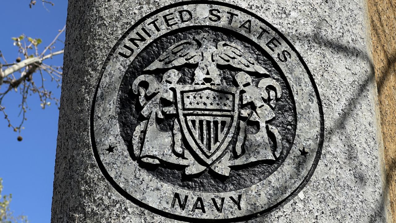 United States Navy emblem on a circular surface with surrounding trees, sky visible in the background, Walnut Creek, California, April 18, 2023. (Photo by Smith Collection/Gado/Getty Images)