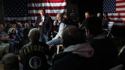 Republican presidential candidate Florida Gov. Ron DeSantis (L) takes a question from an audience member at a campaign event at The Grass Wagon on January 13, 2024 in Council Bluffs, Iowa.
