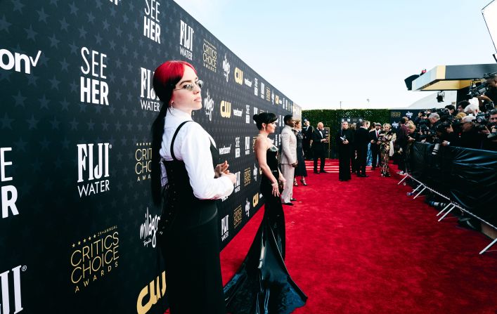 Billie Eilish walks the red carpet before the show. <a href="index.php?page=&url=https%3A%2F%2Fwww.cnn.com%2F2024%2F01%2F15%2Fstyle%2Fred-carpet-critics-choice-awards-2024%2Findex.html" target="_blank">See more looks from the red carpet.</a>