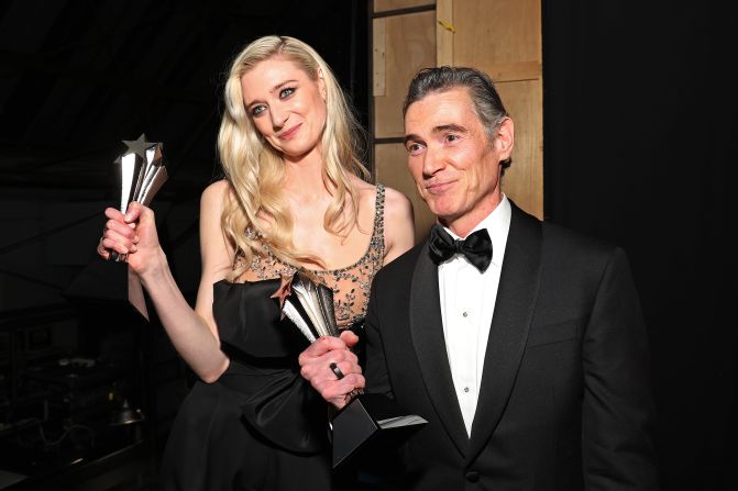 Elizabeth Debicki and Billy Crudup hold their awards for best supporting actress and best supporting actor in a drama series, respectively.