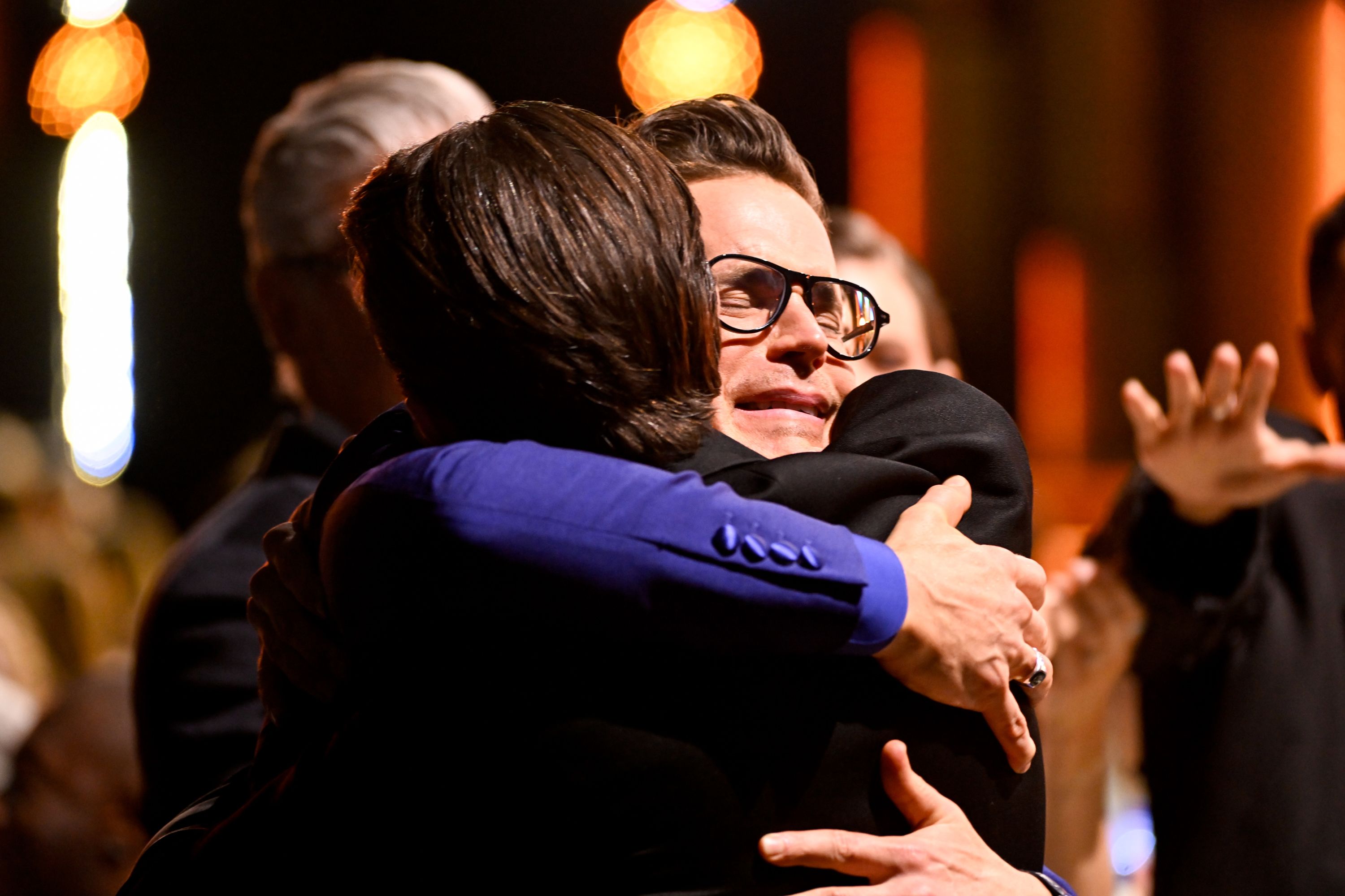 Jonathan Bailey and Matt Bomer embrace after Bailey won best supporting actor in a limited series or movie made for television for "Fellow Travelers."