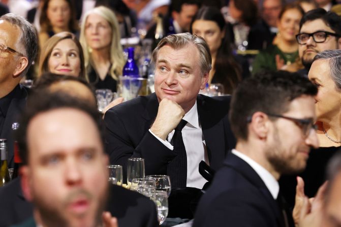 Christopher Nolan watches the show. Nolan won the best director award for "Oppenheimer."