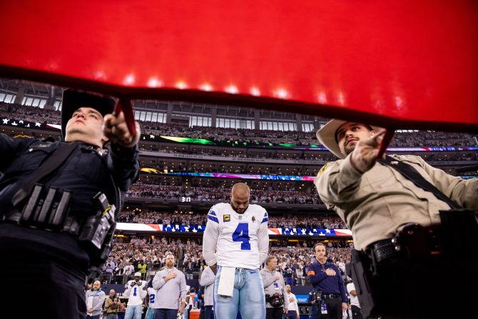 Dallas quarterback Dak Prescott stands for the national anthem before the game against Green Bay on January 14.