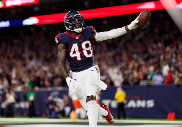 Houston Texans linebacker Christian Harris celebrates after returning an interception for a touchdown against the Cleveland Browns on January 13. The Texans returned two interceptions for touchdowns as they defeated the Browns 45-14.