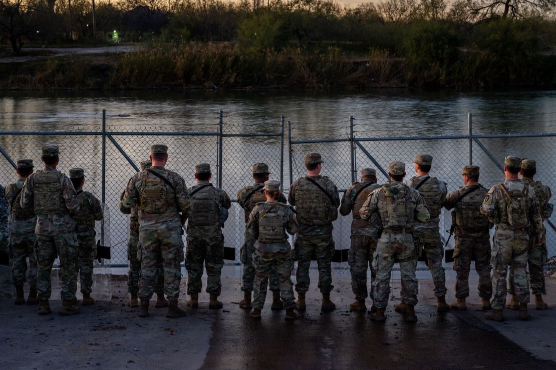 EAGLE PASS, TEXAS - JANUARY 12: National Guard soldiers stand guard on the banks of the Rio Grande river at Shelby Park on January 12, 2024 in Eagle Pass, Texas. The Texas National Guard continues its blockade and surveillance of Shelby Park in an effort to deter illegal immigration. The Department of Justice has accused the Texas National Guard of blocking Border Patrol agents from carrying out their duties along the river. (Photo by Brandon Bell/Getty Images)