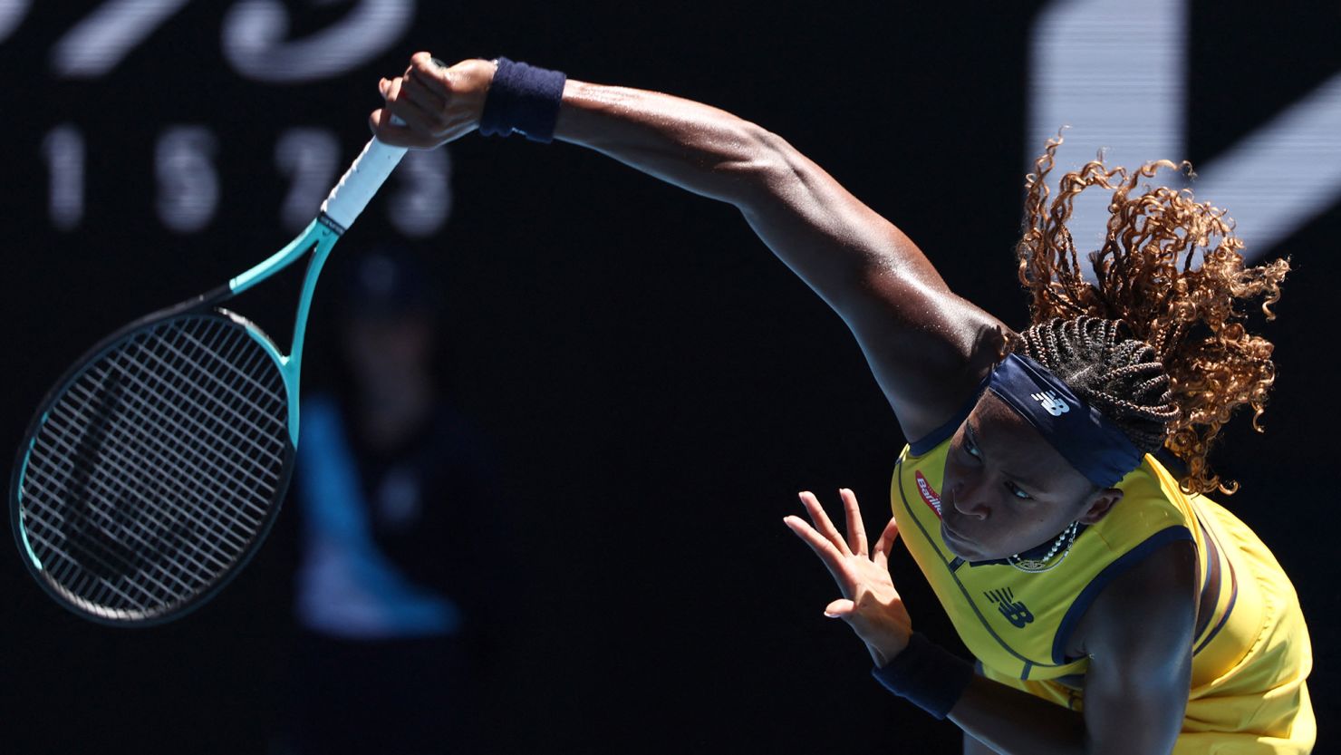 TOPSHOT - USA's Coco Gauff serves against Slovakia's Anna Karolina Schmiedlova during their women's singles match on day two of the Australian Open tennis tournament in Melbourne on January 15, 2024. (Photo by David GRAY / AFP) / -- IMAGE RESTRICTED TO EDITORIAL USE - STRICTLY NO COMMERCIAL USE -- (Photo by DAVID GRAY/AFP via Getty Images)