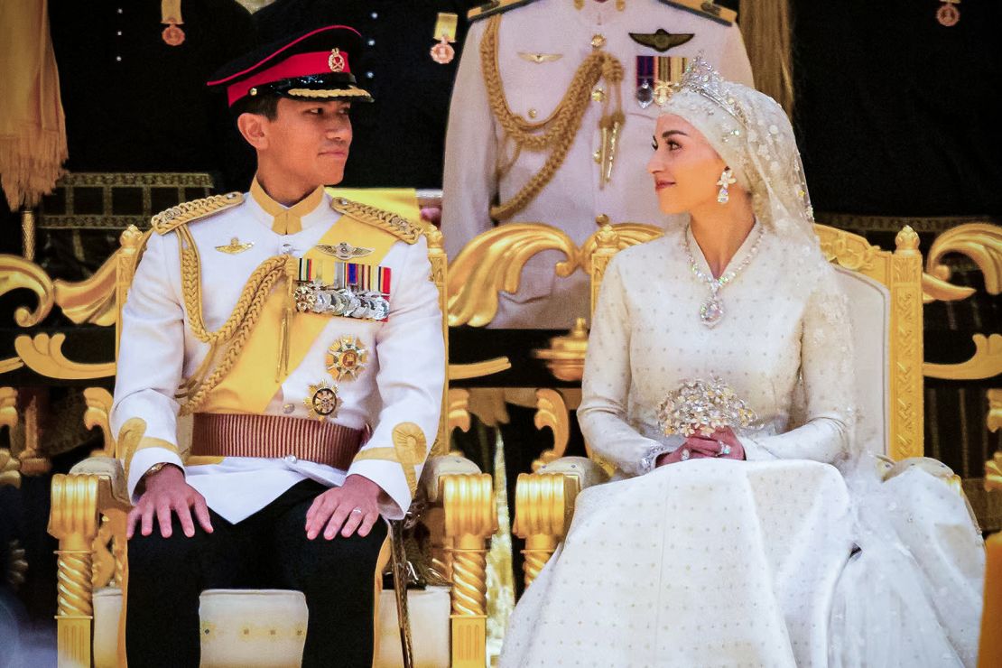 Prince Abdul Mateen (L) and Yang Mulia Anisha Rosnah sit during their wedding reception at Istana Nurul Iman in Brunei's capital Bandar Seri Begawan on January 14, 2024. Lavish celebrations for the wedding of Brunei's Prince Abdul Mateen and his wife reached a climax on January 14 with a glittering ceremony attended by government leaders and blue-blooded guests from Asia and the Middle East.