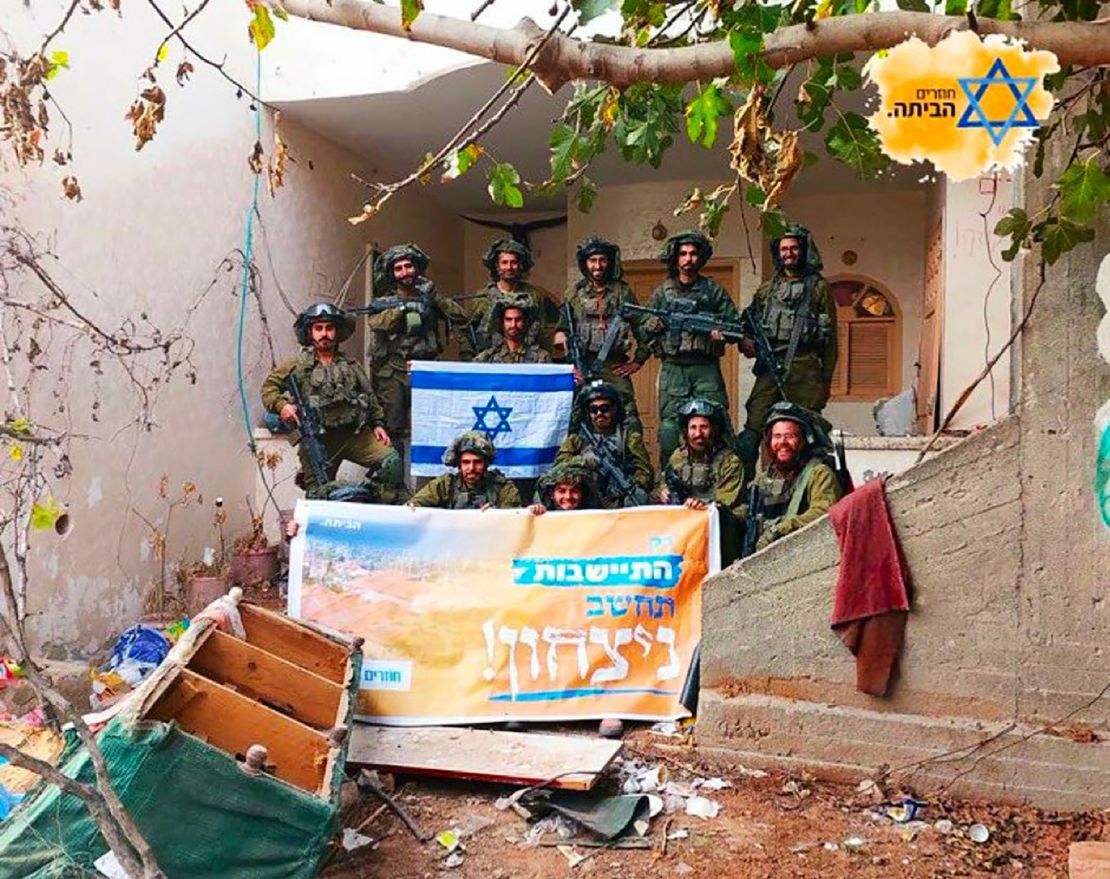 The banner in the image of the soldiers in front of the building reads: "Only settlement would be considered victory!"