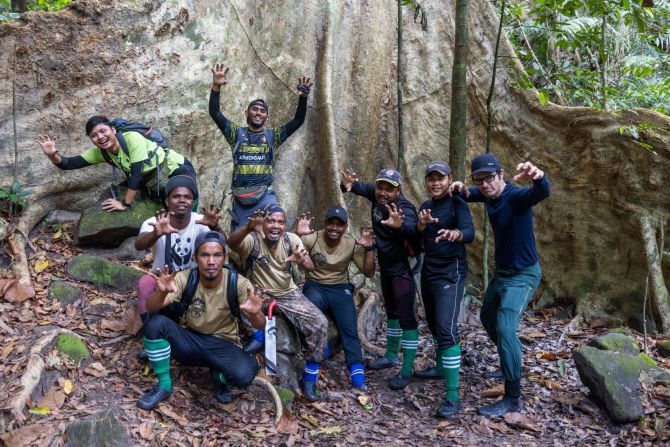 Rondeau (far right) didn't work alone. Conservationists from WWF-Malaysia and rangers from anti-poaching teams helped him to navigate the rainforest and carry 300 pounds of camera equipment.