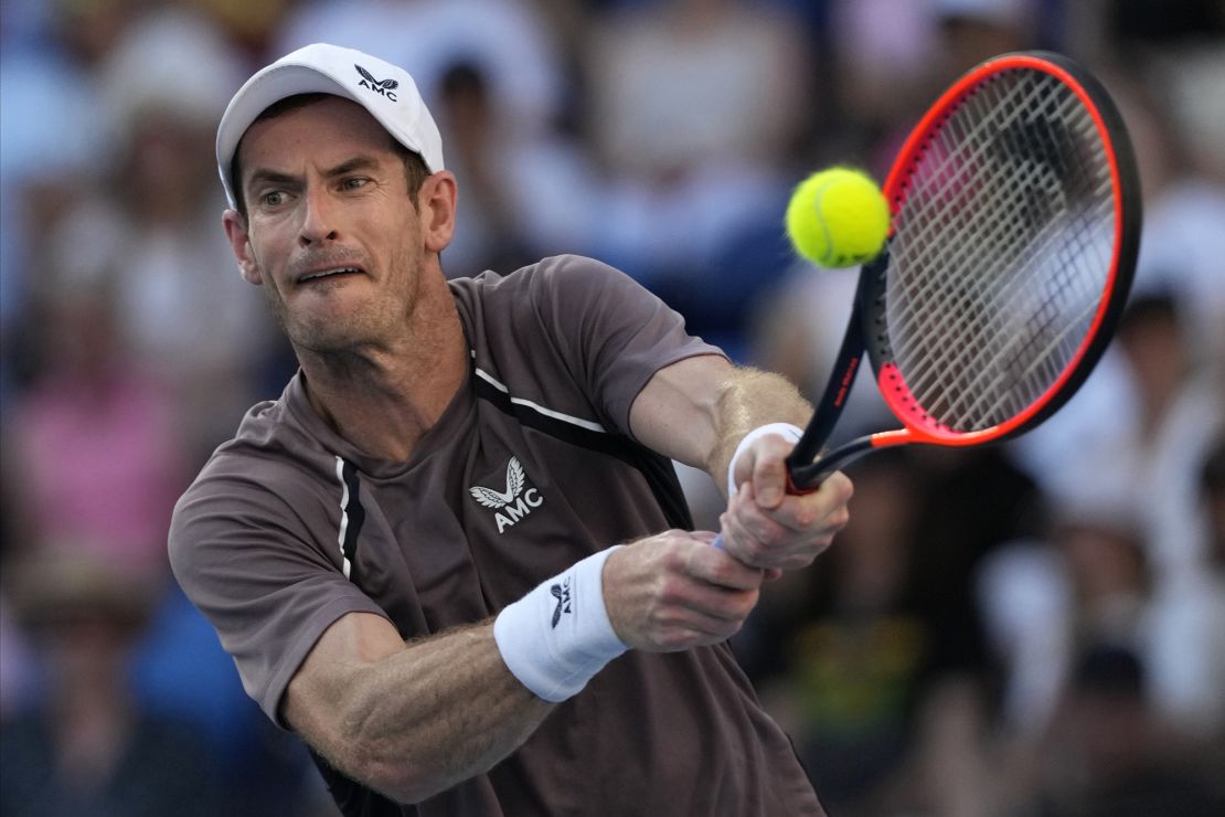 Andy Murray of Britain plays a backhand return to Tomas Martin Etcheverry of Argentina during their first round match at the Australian Open tennis championships at Melbourne Park, Melbourne, Australia, Monday, Jan. 15, 2024. (AP Photo/Andy Wong)