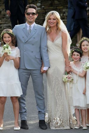 Kate Moss and Jamie Hince pose with bridesmaids after getting married on July 1, 2011 in Southrop, England.