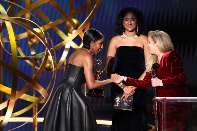 Christina Applegate, right, presents Ayo Edebiri with the Emmy for outstanding supporting actress in a comedy series ("The Bear").