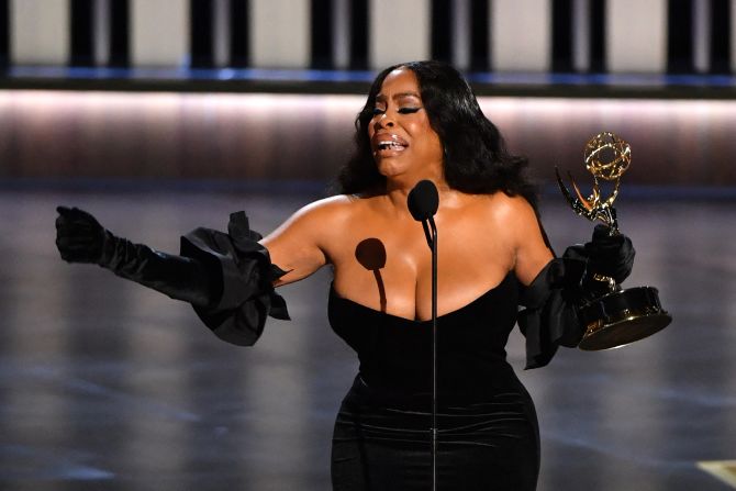 Niecy Nash-Betts accepts the Emmy for outstanding supporting actress in a limited series or TV movie ("Dahmer — Monster: The Jeffrey Dahmer Story"). She said she accepted her award on behalf of Black women who had been "unheard and over-policed," listing several high-profile examples of the latter.