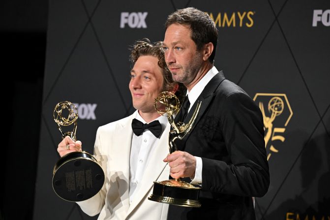 Moss-Bachrach, right, and Jeremy Allen White, two stars of "The Bear," show off the acting Emmys that they won on Monday.