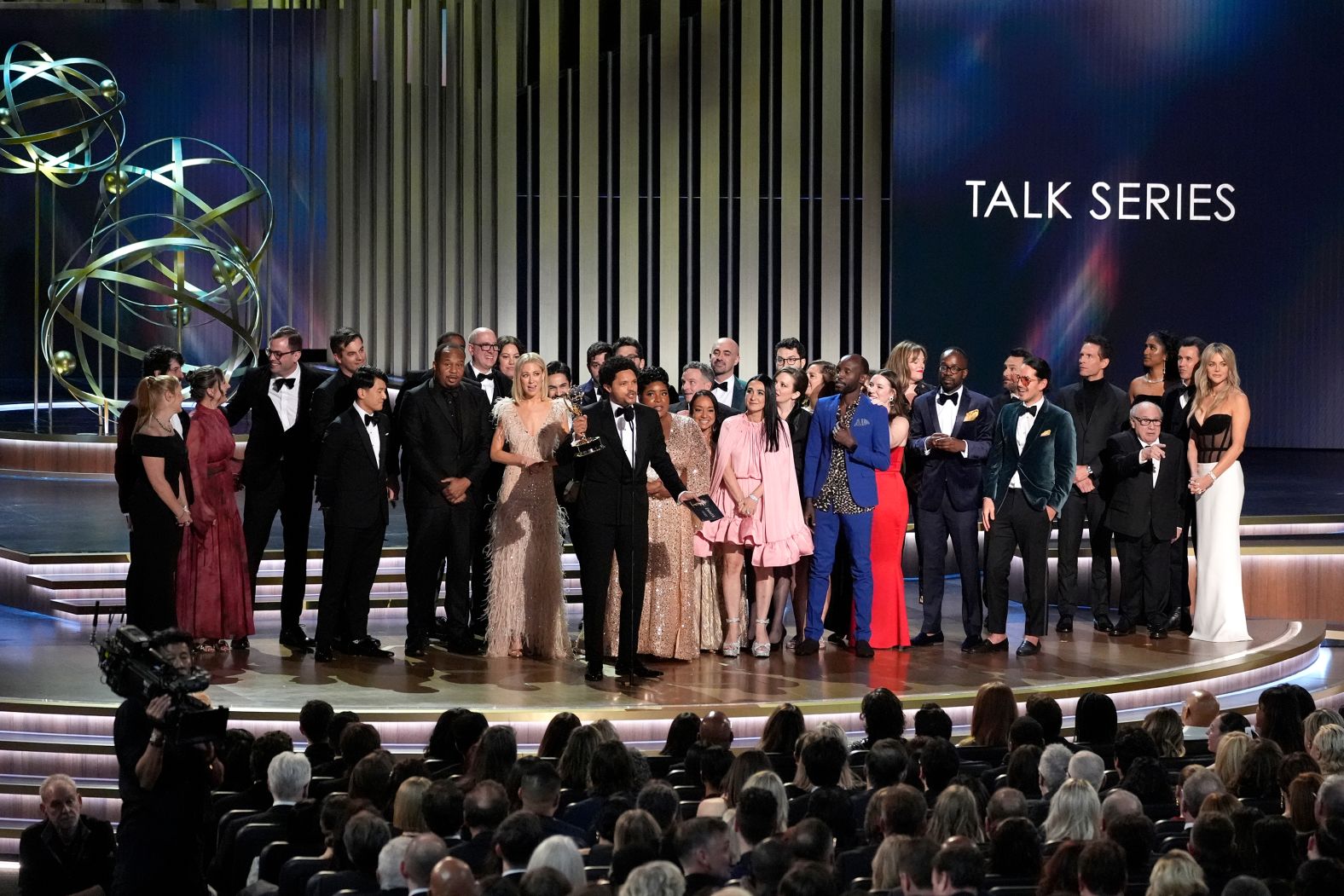 Trevor Noah and the rest of "The Daily Show" team accept the Emmy for outstanding talk series.