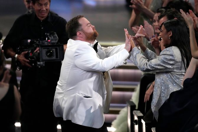 Paul Walter Hauser reacts after winning the Emmy for outstanding supporting actor in a limited or anthology series or movie ("Black Bird").