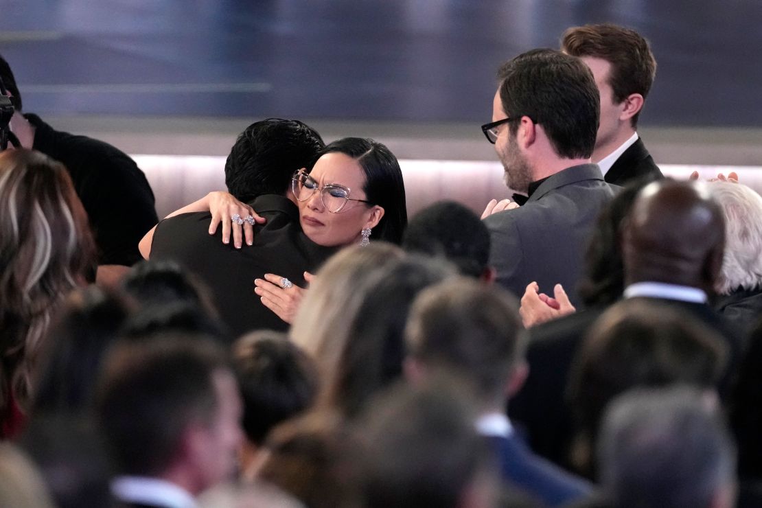 Ali Wong, left, embraces Steven Yeun after he wins the award for outstanding lead actor in a limited or anthology series or movie for "Beef" during the 75th Primetime Emmy Awards on Monday, Jan. 15, 2024, at the Peacock Theater in Los Angeles.