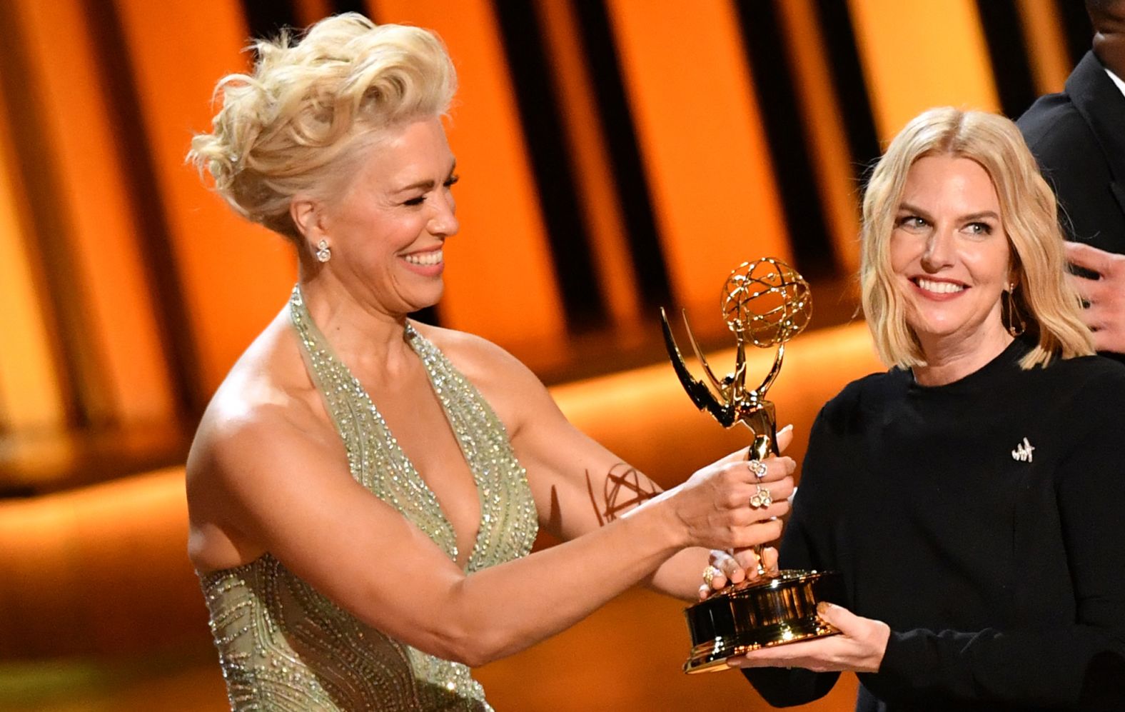 Hannah Waddingham, left, presents the Governors Award to GLAAD President and CEO Sarah Kate Ellis. GLAAD is the advocacy group on behalf of LGBTQ images in media.