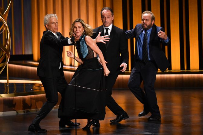 From left, "Ally McBeal" cast members Greg Germann, Calista Flockhart, Gil Bellows and Peter MacNicol dance on their way to present an award.