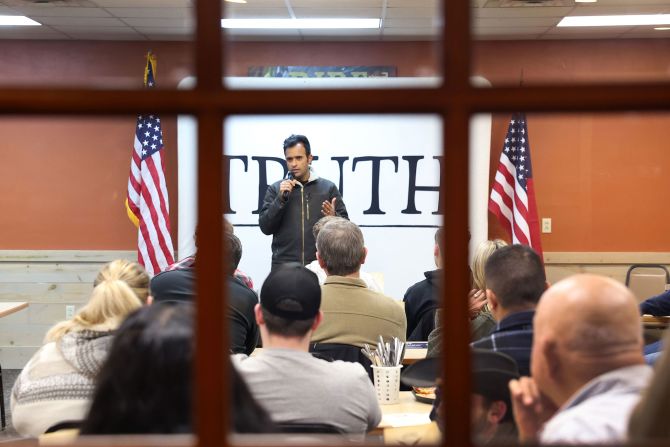 Ramaswamy speaks to guests during a campaign stop in Independence, Iowa, in January 2024.