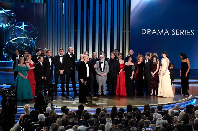 "Succession" creator Jesse Armstrong is joined by members of the cast to accept the Emmy for outstanding drama series.