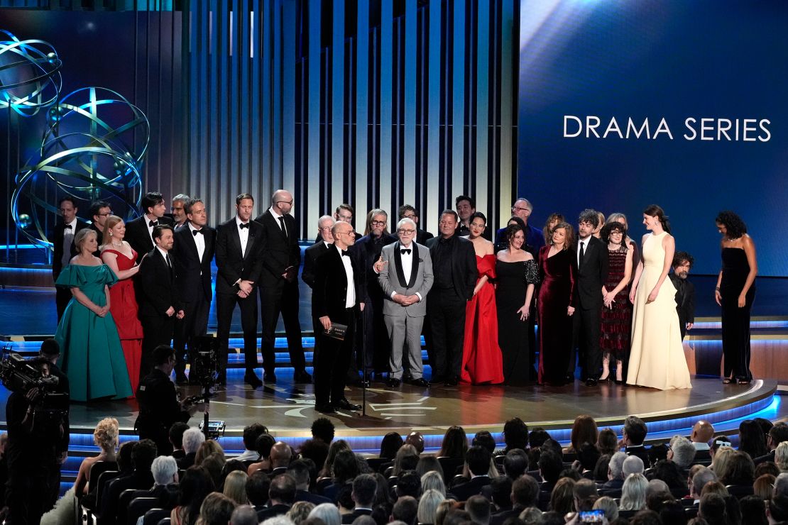 Jesse Armstrong, center, and the team from "Succession" accept the award for outstanding drama series during the 75th Primetime Emmy Awards on Monday, Jan. 15, 2024, at the Peacock Theater in Los Angeles.