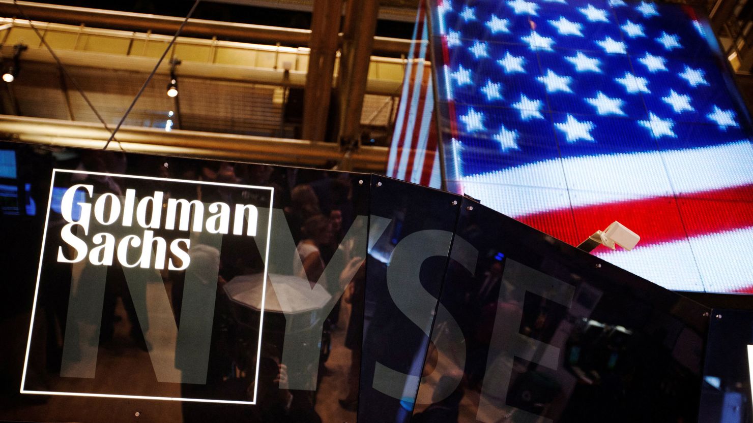 FILE PHOTO: The Goldman Sachs logo is displayed on a post above the floor of the New York Stock Exchange, September 11, 2013. REUTERS/Lucas Jackson/File Photo