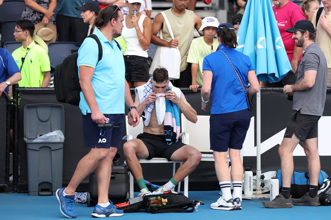 MELBOURNE, AUSTRALIA - JANUARY 16: Jack Draper of Great Britain vomits after winning his round one singles match against Marcos Giron of the United States during the 2024 Australian Open at Melbourne Park on January 16, 2024 in Melbourne, Australia. (Photo by Julian Finney/Getty Images)