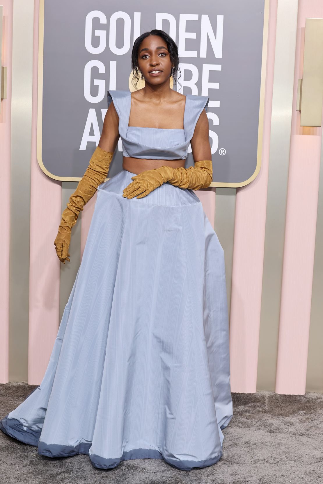 A little rain did not detract from this Rosie Assoulin look, worn to the 2023 Golden Globe Awards on January 10. Edebiri was an early adopter of the opera glove trend, too.