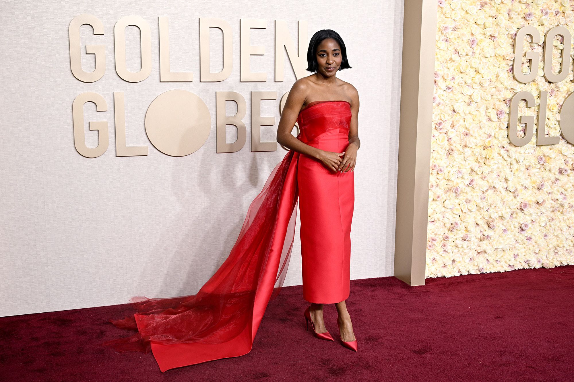 "The Bear" actor Ayo Edebiri has swapped her chef’s whites for some seriously good red carpet looks of late, including this Prada dress with a train for the Golden Globe Awards on January 7, 2024.