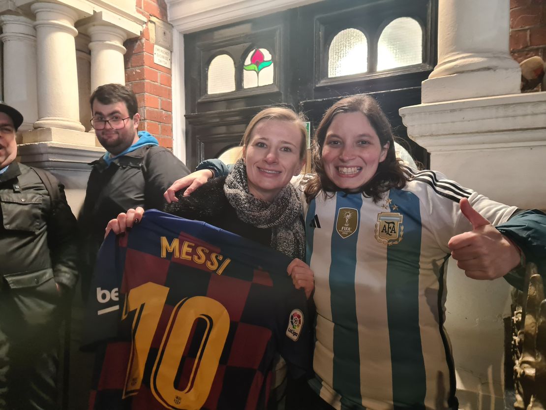 Juan Pirot (L) and Romina Polenta (R) stood in a huddle of fans hoping to catch a glimpse of Lionel Messi, who ended up not attending the event.