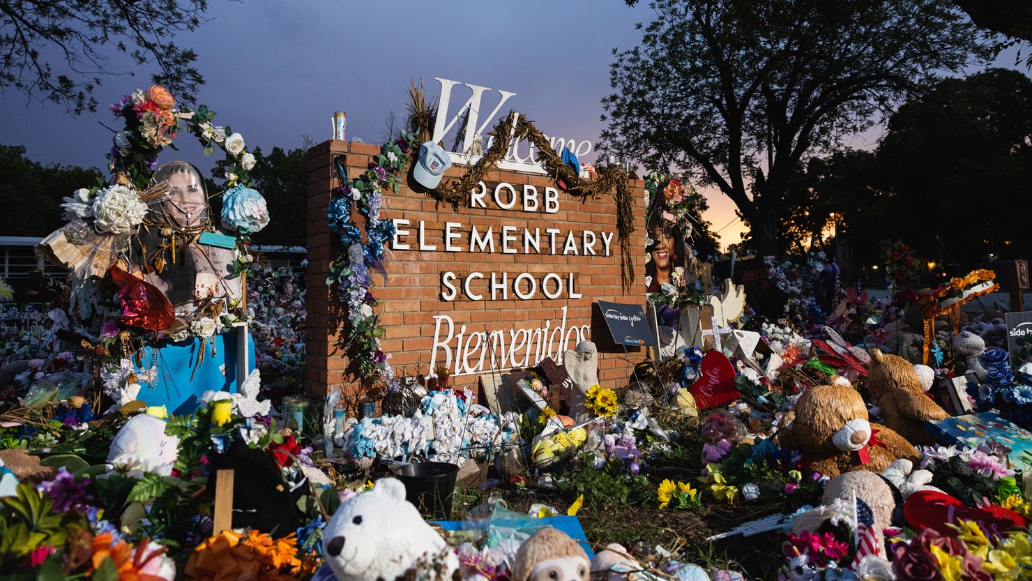 UVALDE, TX - AUGUST 24: The sun sets behind the memorial for the victims of the massacre at Robb Elementary School on August 24, 2022 in Uvalde, Texas. The Consolidated Independent School District Board today fired Police Chief Pete Arredondo over police response during the May 24 massacre, America's deadliest school shooting since 2012.  (Photo by Jordan Vonderhaar/Getty Images)