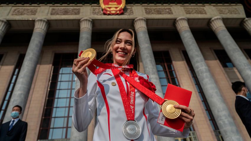 U.S. born freestyle skier Eileen Gu, or Gu Ailing, poses with her two gold medals and a silver medal before a ceremony to honour the contributions to the Beijing 2022 Winter Olympics and Paralympics at the Great Hall of the People on April 8, 2022 in Beijing, China.
