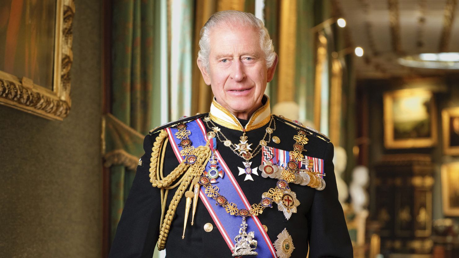 This photo provided by the Buckingham Palace on Monday, Jan.15, 2024 is the new official portrait of Britain's King Charles III  taken in 2023 at Windsor Castle, England. Copies of the portrait will hang in public buildings throughout the United Kingdom as part of a Government-funded scheme. King Charles III is wearing a Royal Navy uniform of an Admiral of the Fleet and official medals and decorations. A copy of the portrait is being offered to public authorities free-of-charge as part of a scheme to celebrate the new reign. (Hugo Burnand/Royal Household 2024 via AP)