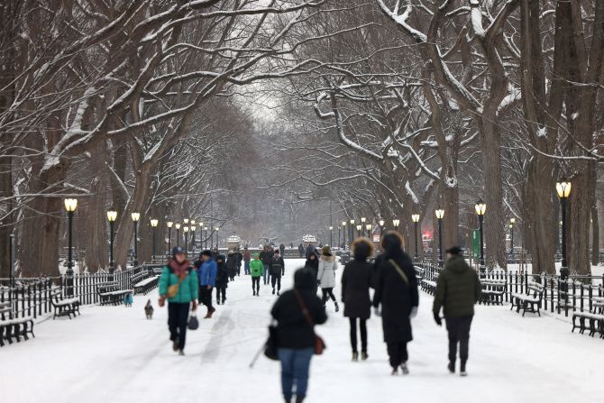 People walk in New York's Central Park on January 16. Enough snow fell in New York, Philadelphia, Baltimore and Washington, DC, to end nearly two-year-long waits for an inch of snow there.