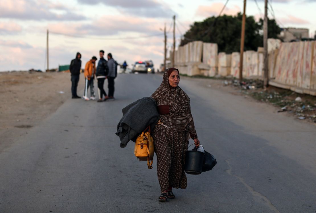 People are carrying some of their belongings as they leave for Rafah in the southern Gaza Strip on January 4, 2024, after fleeing the central Gaza Strip amid ongoing battles between Israel and the Palestinian Hamas movement. (Photo by Majdi Fathi/NurPhoto via Getty Images)