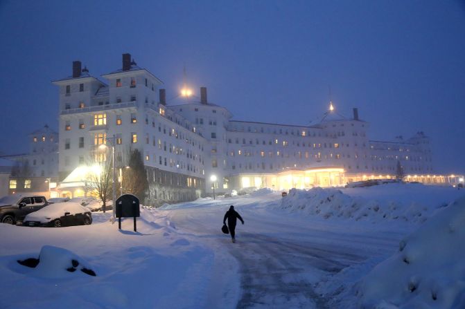 A person makes his way to the Omni Mount Washington Resort toward the Nikki Haley event during a bad snow storm in Bretton Woods, New Hampshire, on Tuesday, January 16.